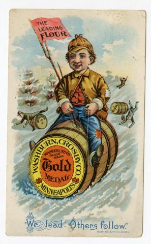 Boy rides barrel labeled "Gold Medal" and holds a "leading flour" stick with bottom font stating "We lead: Others follow"