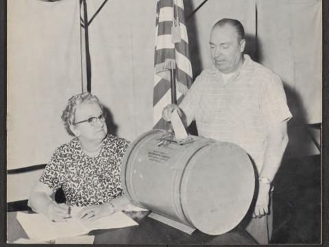 Trial run for voting with village clerk, Ruth Harris, 1962
