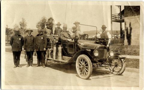 Fire department members with a firetruck