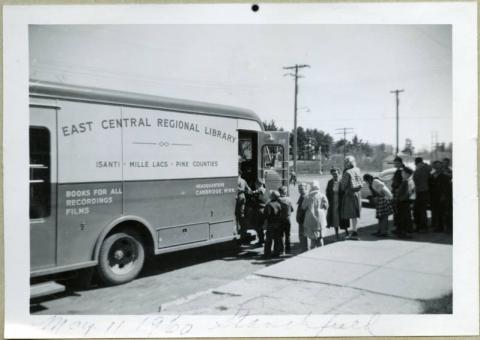 Line outside of bookmobile visiting Stanchfield, East Central Regional Library System, Stanchfield, Minnesota