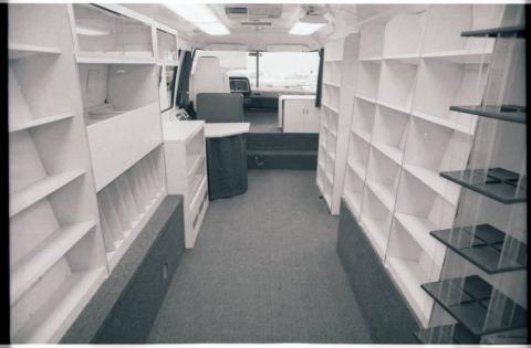 Mobile Library interior bookshelves and driver's seat, Hennepin County, Minnesota