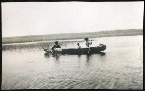 Three people in a canoe