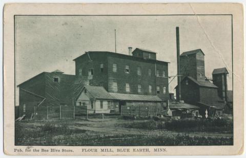 Post card of brick and wood buildings at Blue Earth's mill