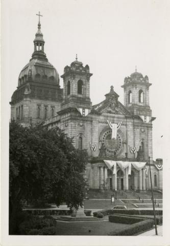 Exterior of basilica with hanging banners of celebration
