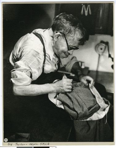 Tailor working at the YMCA, Minneapolis, 1937