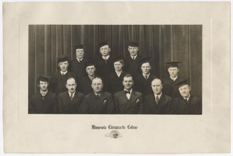 Men in suits with graduation caps in a studio