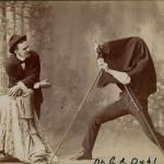Photographer taking a picture of a man in a studio