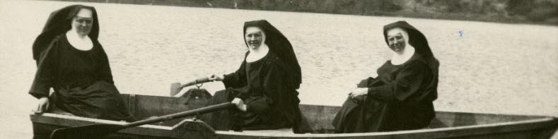 Benedictine sisters in rowboat on Rose Lake, Cotton, Minnesota
