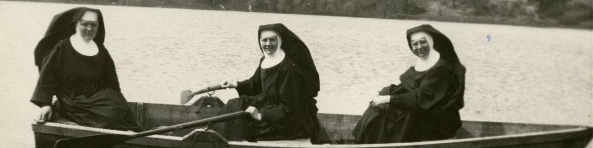 Benedictine sisters in rowboat on Rose Lake, Cotton, Minnesota