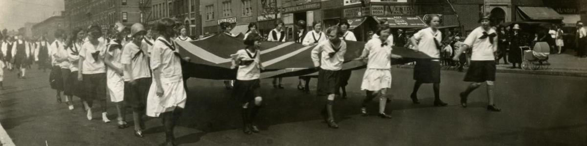 Children holding the Norwegian flag in Norse-American Centennial parade, Leif Ericson Square, New York, New York